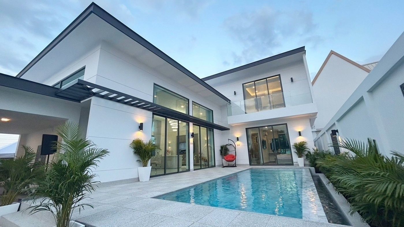 Layan Chak Nok villa courtyard and pool at dusk